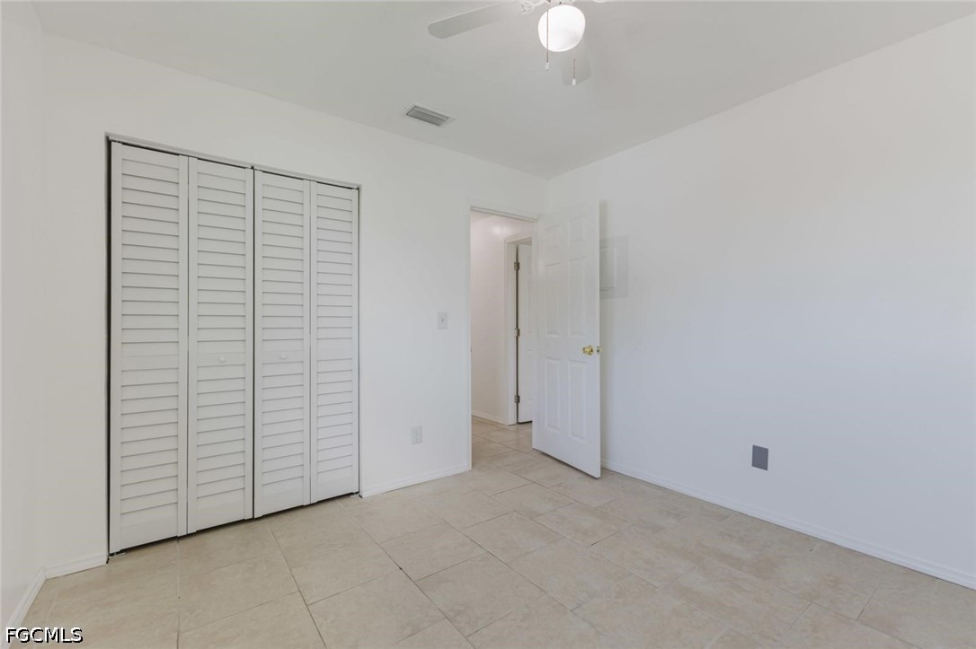 16595 Davis Road Fort Myers, FL 33908 - Photo 10 of 31 an empty room with closet