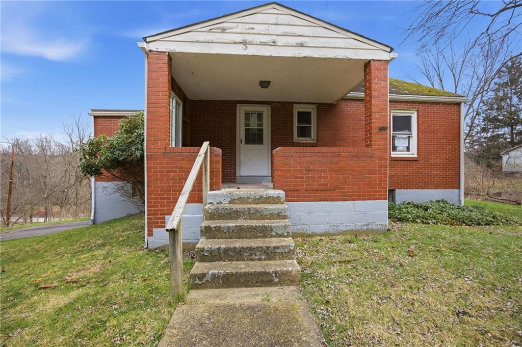 105 Pine Street Trafford, PA 15085 - Photo 1 of 22 a front view of a house with a yard