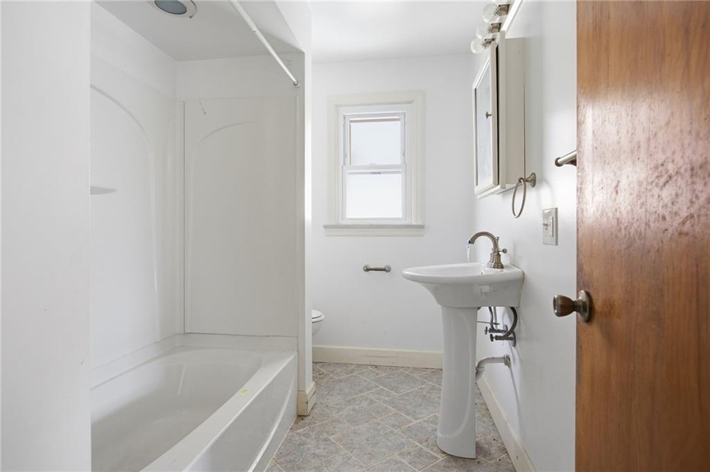 105 Pine Street Trafford, PA 15085 - Photo 13 of 22 a bathroom with a sink a toilet and bathtub
