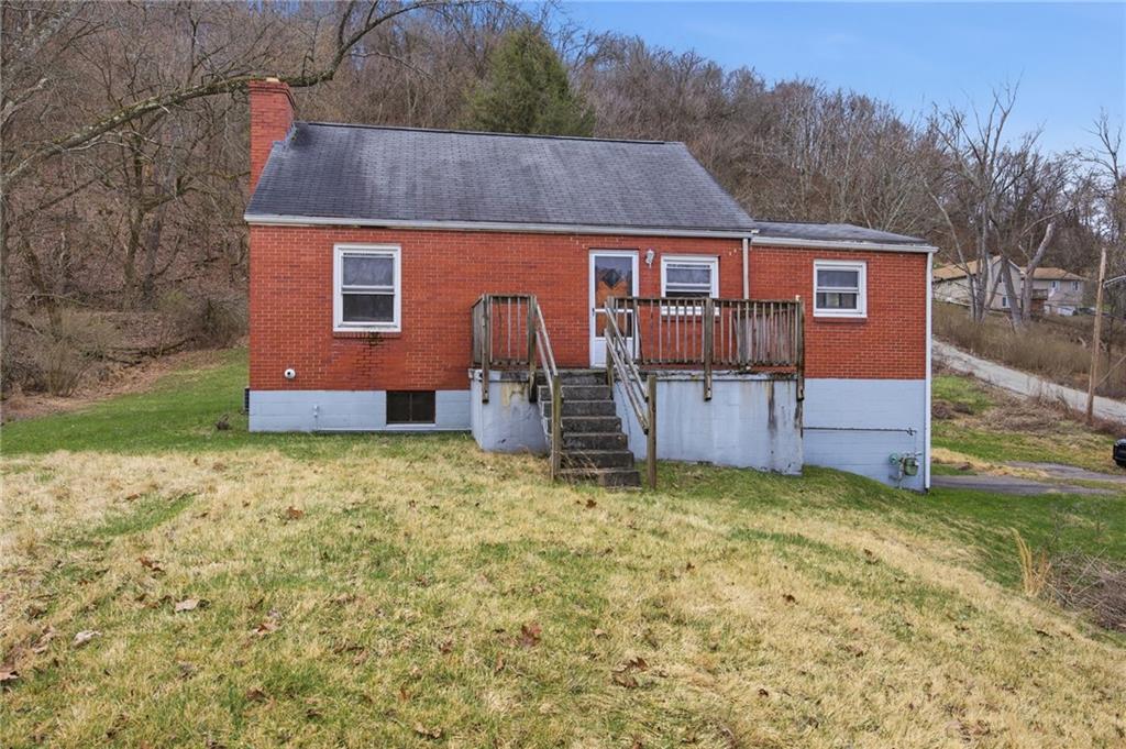 105 Pine Street Trafford, PA 15085 - Photo 2 of 22 a front view of a house with a yard
