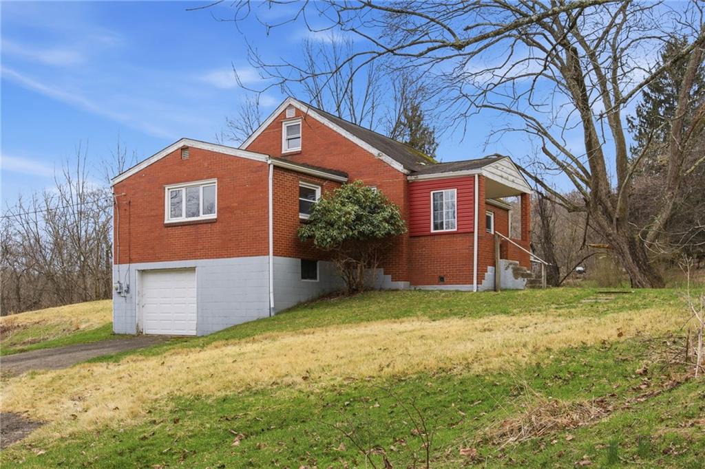105 Pine Street Trafford, PA 15085 - Photo 21 of 22 a front view of house with yard