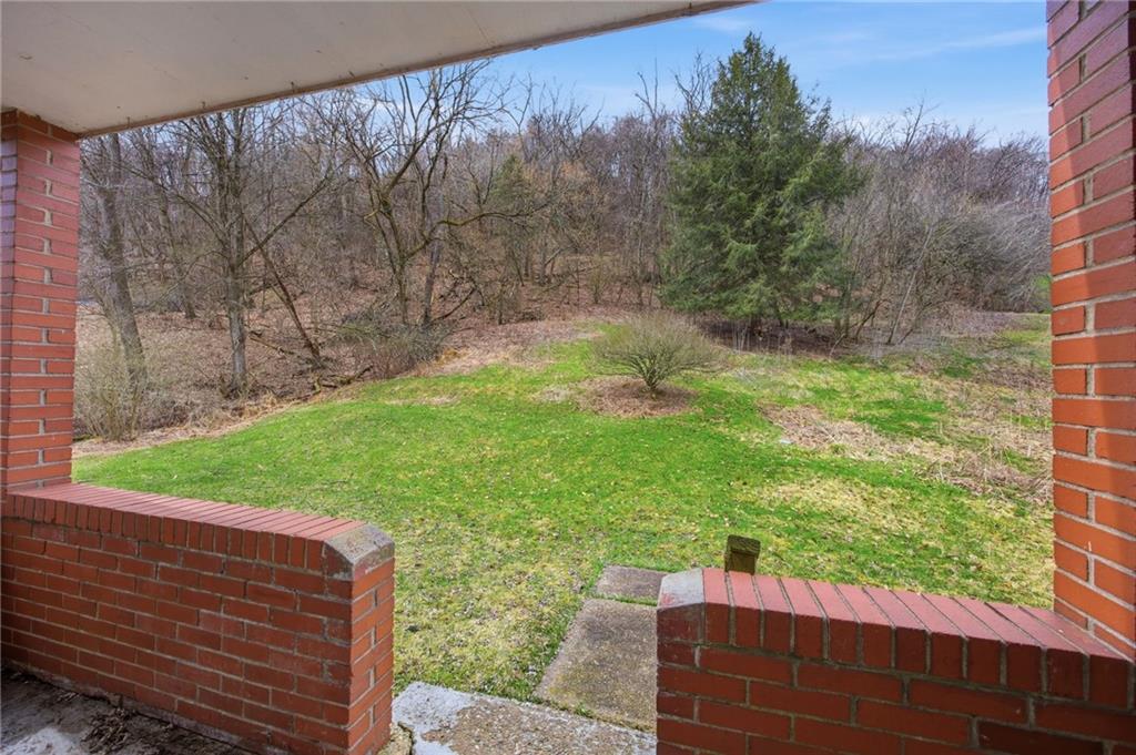 105 Pine Street Trafford, PA 15085 - Photo 4 of 22 a view of a backyard with wooden fence