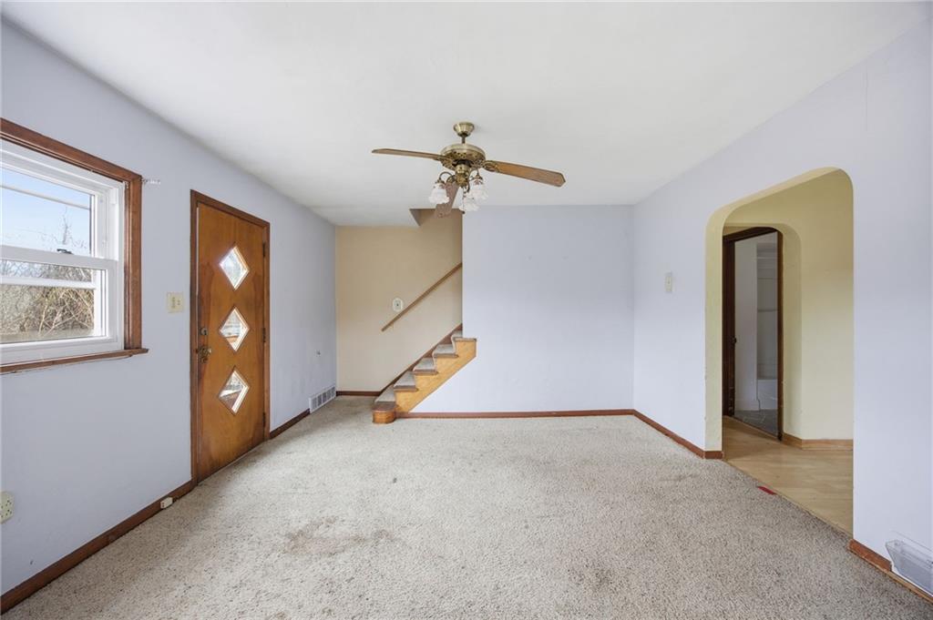 105 Pine Street Trafford, PA 15085 - Photo 6 of 22 a view of a livingroom with a staircase