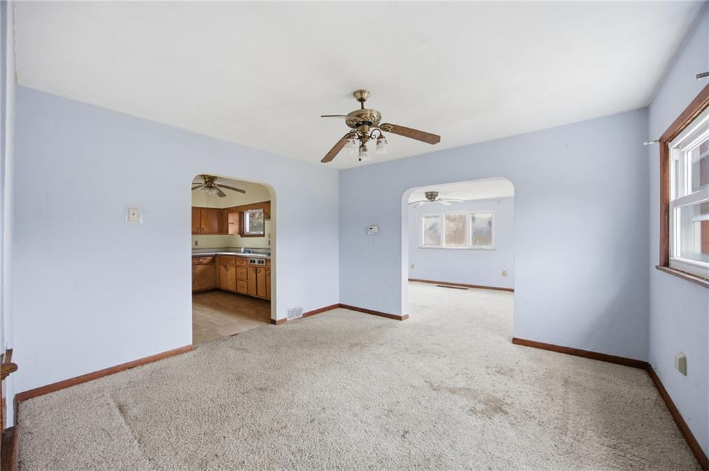 105 Pine Street Trafford, PA 15085 - Photo 8 of 22 a view of a livingroom with a ceiling fan and window
