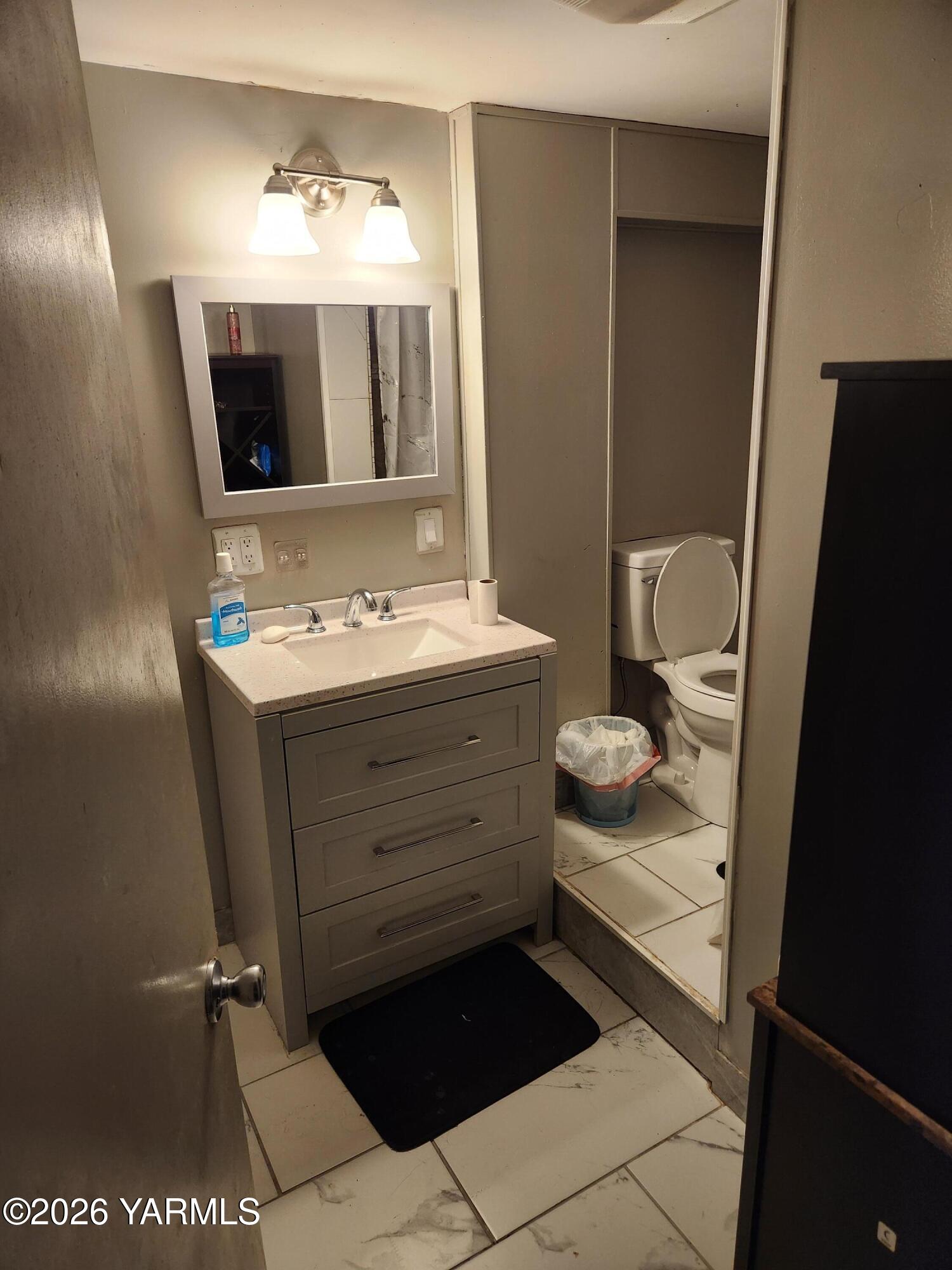 2704 Summitview Avenue Yakima, WA 98902 - Photo 11 of 13 a bathroom with a sink and a mirror
