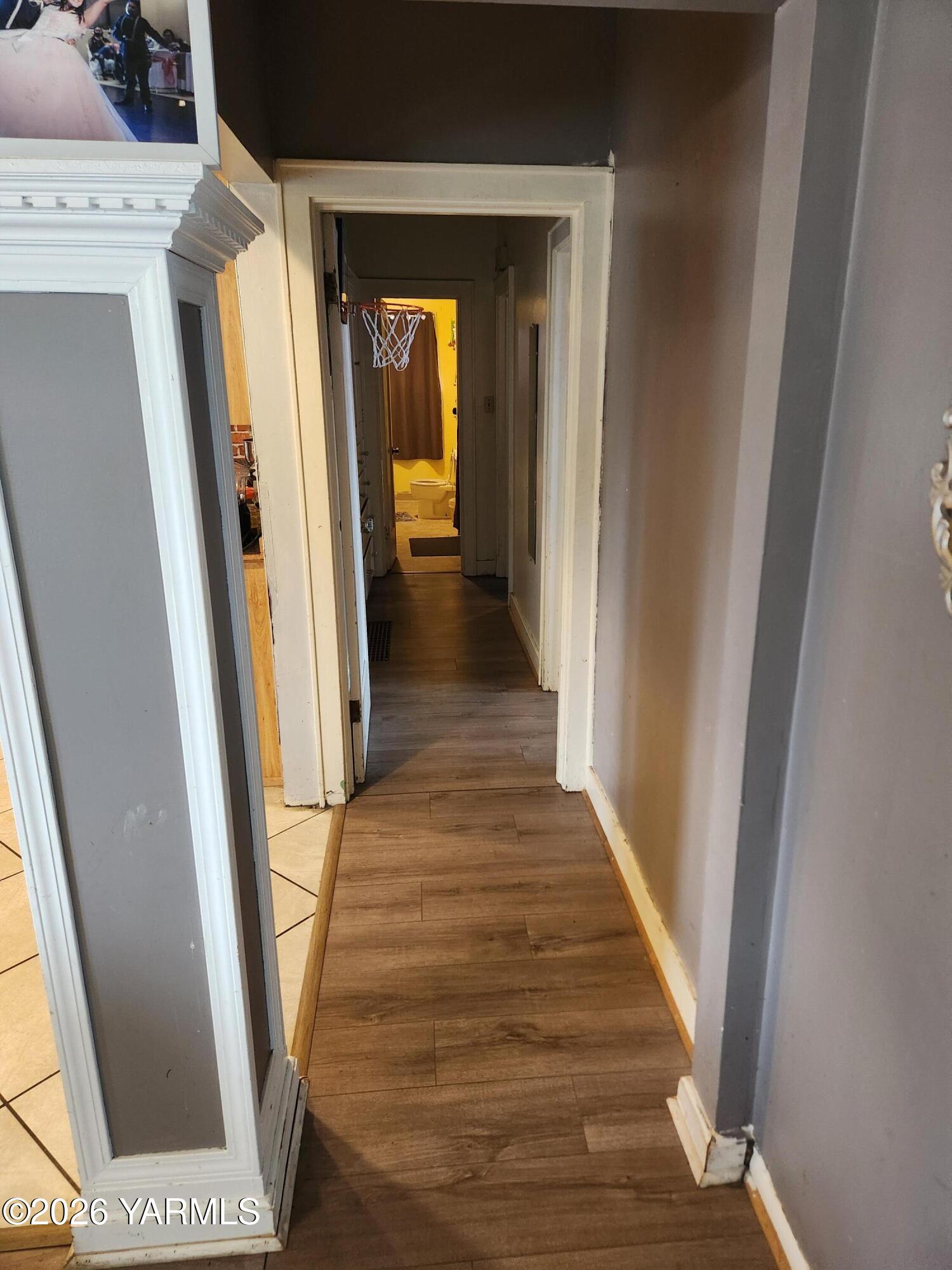 2704 Summitview Avenue Yakima, WA 98902 - Photo 5 of 13 a view of a hallway with wooden floor and staircase