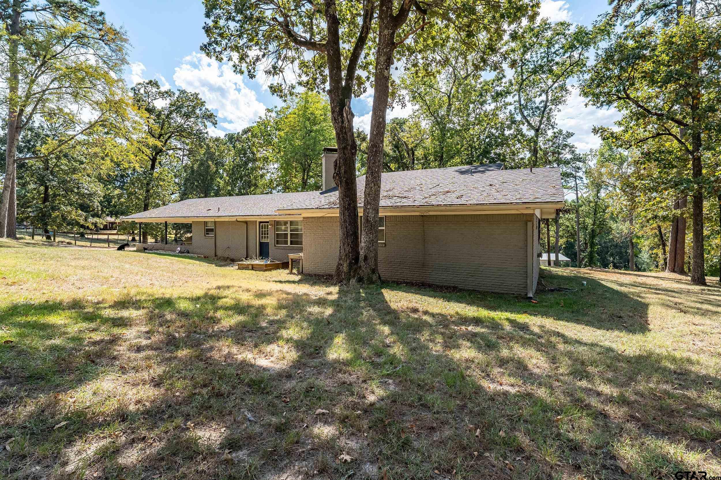 271 Nottingham Rusk, TX 75785 - Photo 21 of 23 a view of a house with backyard and a tree