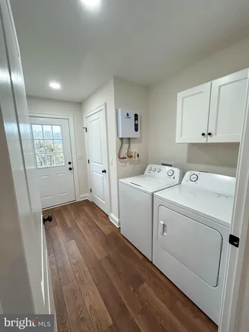 a view of a storage & utility room with a washer dryer