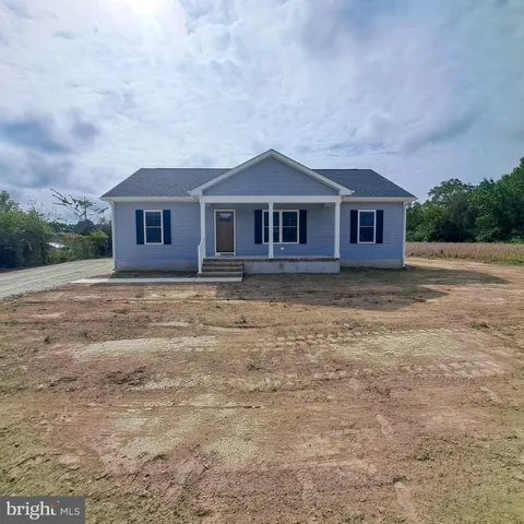 a house with trees in the background