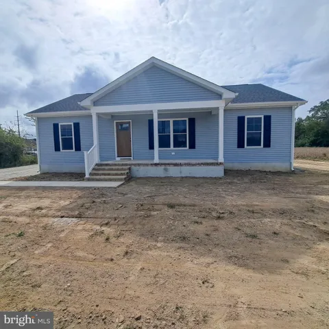 a front view of a house with yard