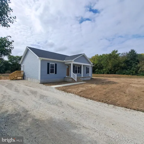 a house with trees in the background