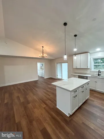 a kitchen with a stove and a sink
