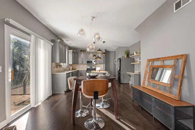 a living room with furniture and stairs