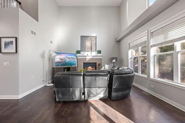 a bathroom with a double vanity sink bathtub and next to a window