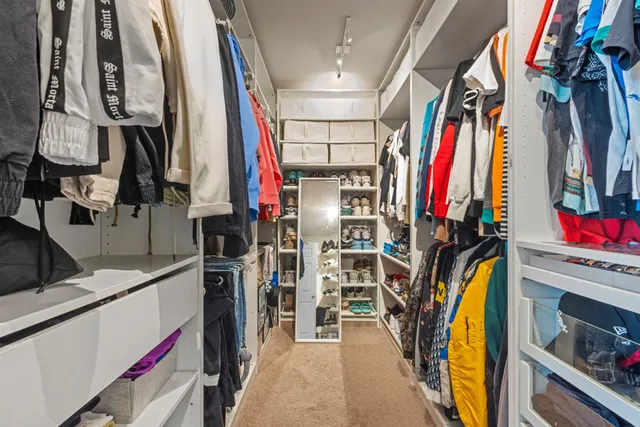 a white toilet sitting next to a bathroom sink