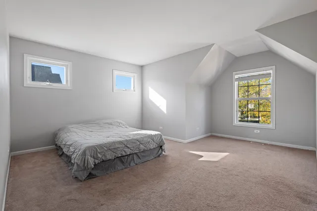 a bathroom with a granite countertop sink mirror vanity and toilet