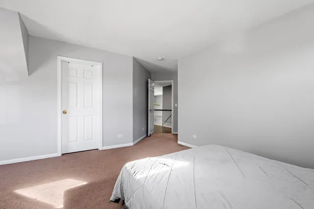 a bathroom with a shower sink mirror and toilet