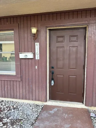 a view of a door and a wooden door