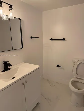 a bathroom with a sink and a toilet