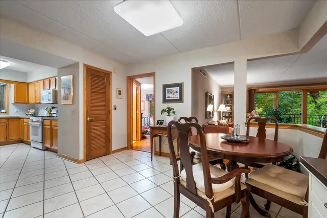 a view of a dining room with furniture window and outside view
