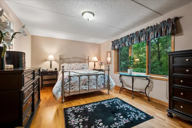 a bedroom with furniture and a window