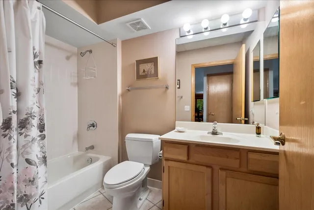 a bathroom with a sink toilet tub and shower