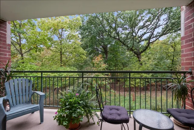 a view of a balcony with an outdoor seating
