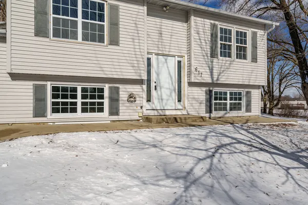 a front view of a house with a empty space
