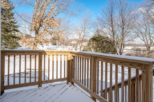 a view of balcony with wooden floor and fence