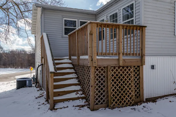 a front view of a house with wooden fence