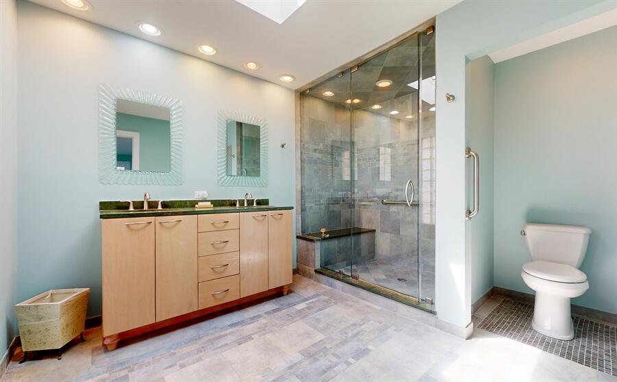 31 Diana Road Portage, IN 46368 - Photo 16 of 29 a bathroom with a granite countertop sink a toilet and shower