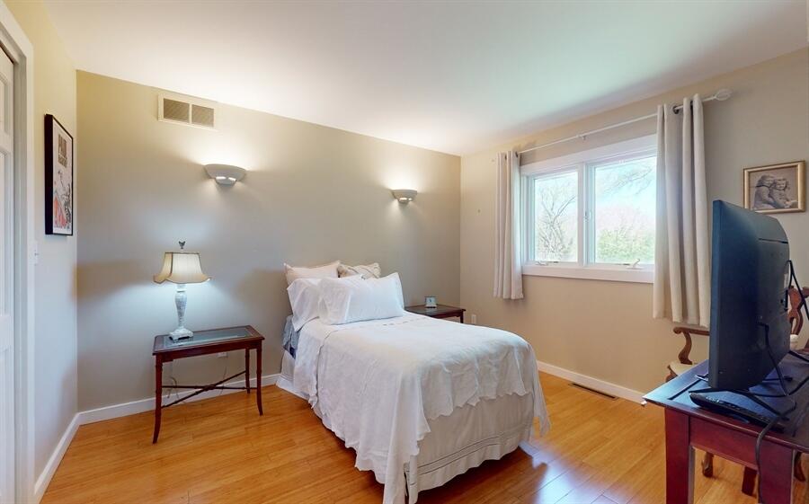 31 Diana Road Portage, IN 46368 - Photo 18 of 29 a bedroom with a bed tv and table