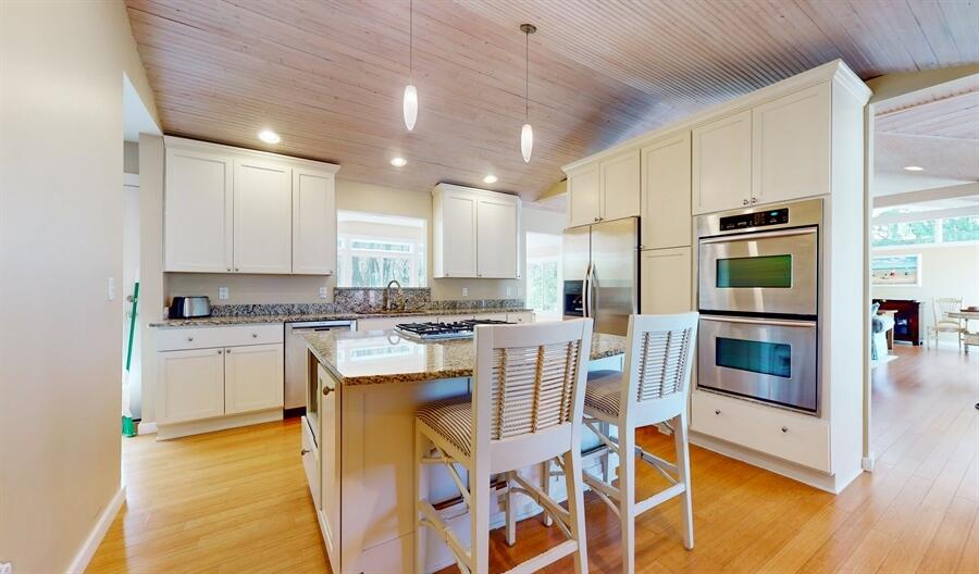31 Diana Road Portage, IN 46368 - Photo 6 of 29 a kitchen with a stove a microwave and white cabinets