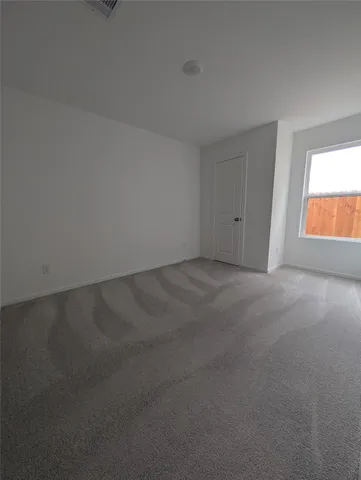 a kitchen with a sink a microwave and cabinets