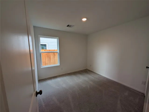 a view of hallway with wooden floor