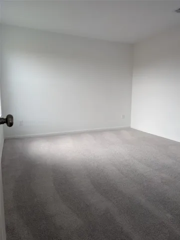 a view of a kitchen with wooden floor and kitchen