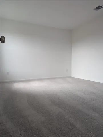 a kitchen with stainless steel appliances wooden floors and wooden cabinets