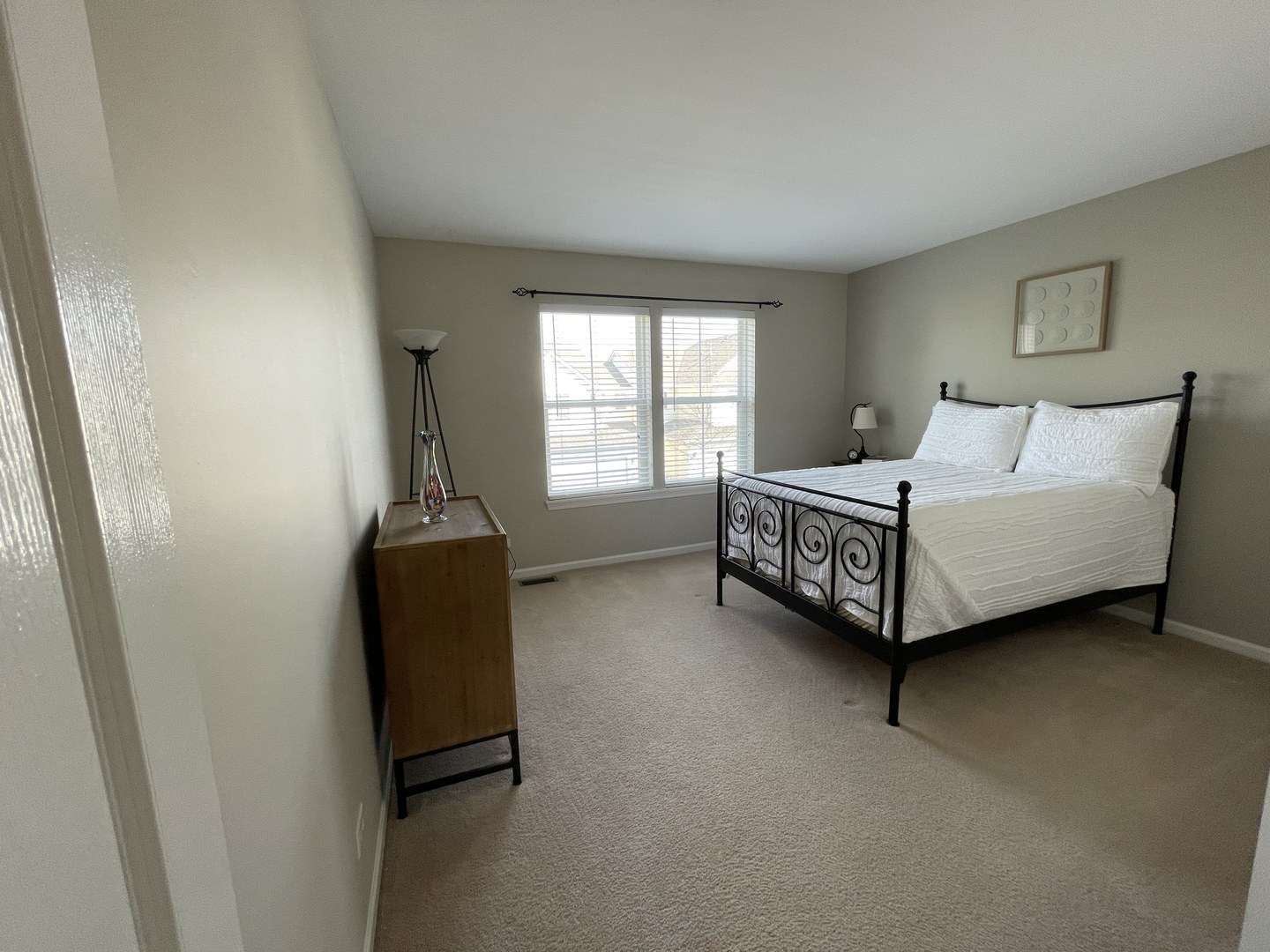 2902 Falling Waters Drive Lindenhurst, IL 60046 - Photo 12 of 14 a bedroom with a bed and a window