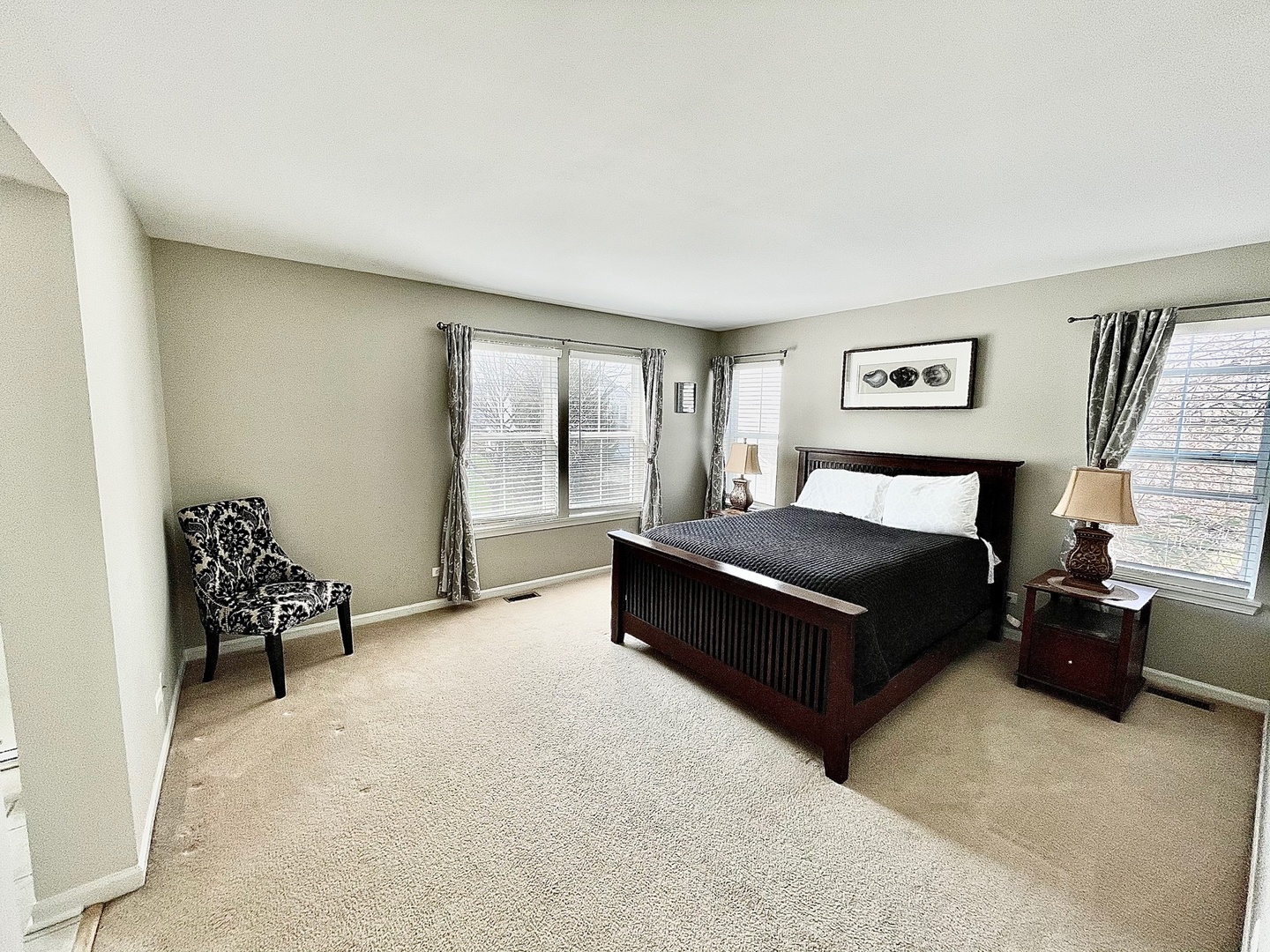 2902 Falling Waters Drive Lindenhurst, IL 60046 - Photo 9 of 14 a bedroom with a bed and a couch