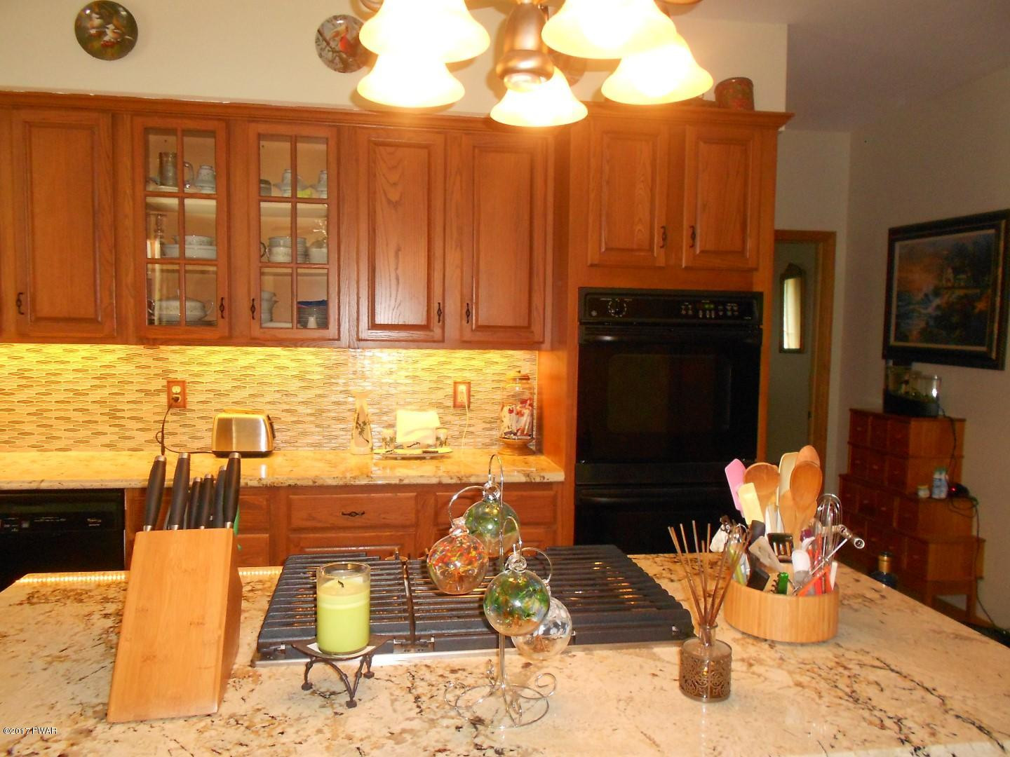 271 Sawmill Road Greentown, PA 18426 - Photo 9 of 36 a living room with fireplace furniture and a flat screen tv