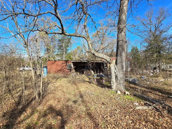 a view of a backyard of the house