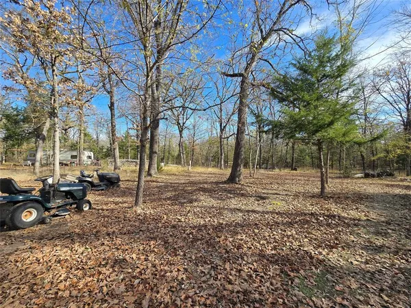a backyard of a house with trees