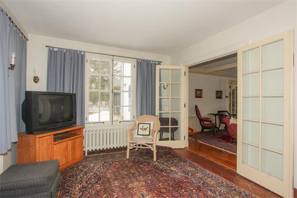 272 Longhill Street Springfield, MA 01108 - Photo 11 of 30 a living room with furniture and a flat screen tv