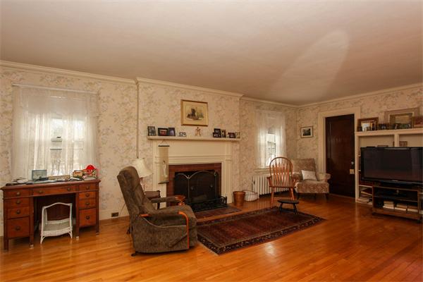 272 Longhill Street Springfield, MA 01108 - Photo 16 of 30 a living room with furniture flat screen tv and fireplace