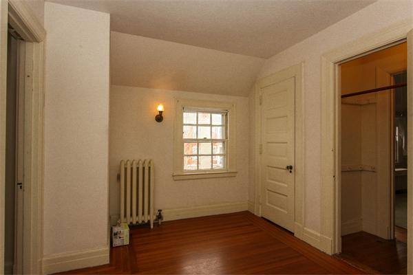 272 Longhill Street Springfield, MA 01108 - Photo 20 of 30 an empty room with wooden floor and a window