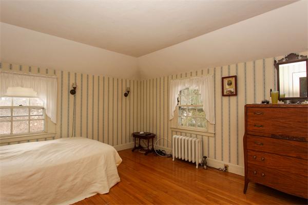 272 Longhill Street Springfield, MA 01108 - Photo 22 of 30 a bedroom with a bed and a dresser