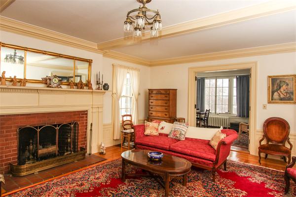 272 Longhill Street Springfield, MA 01108 - Photo 7 of 30 a living room with furniture a fireplace and a window
