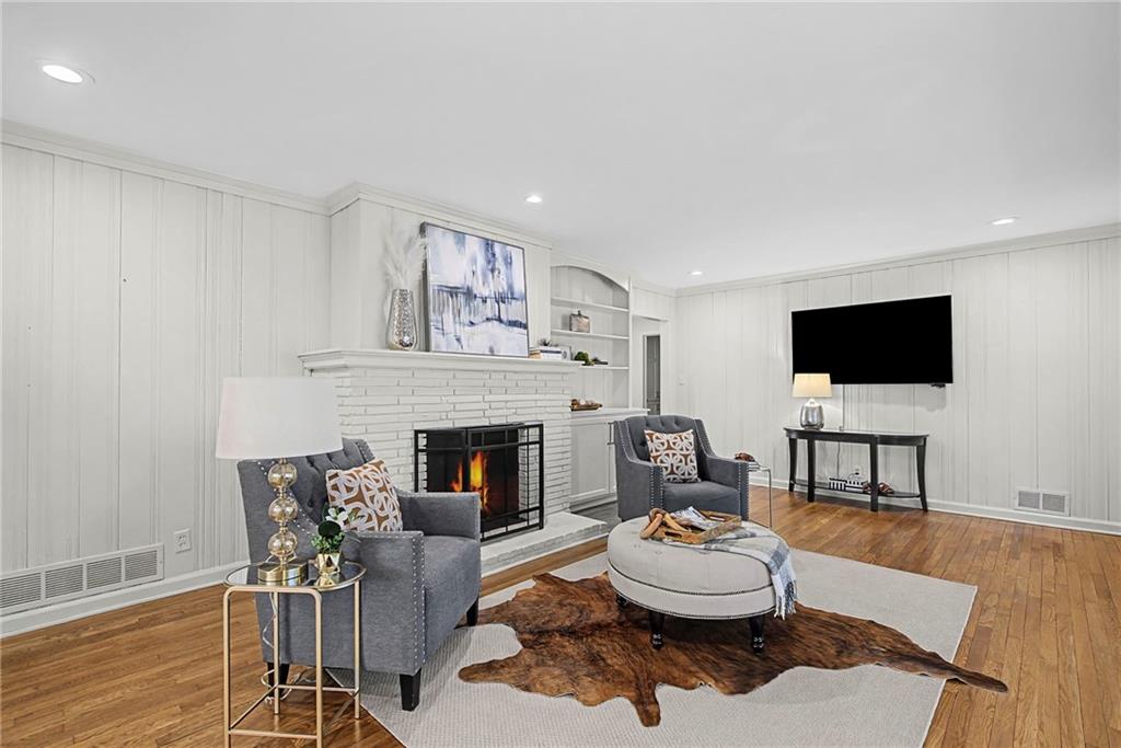 3819 North Stratford Road Northeast Atlanta, GA 30342 - Photo 14 of 48 a living room with furniture and a flat screen tv