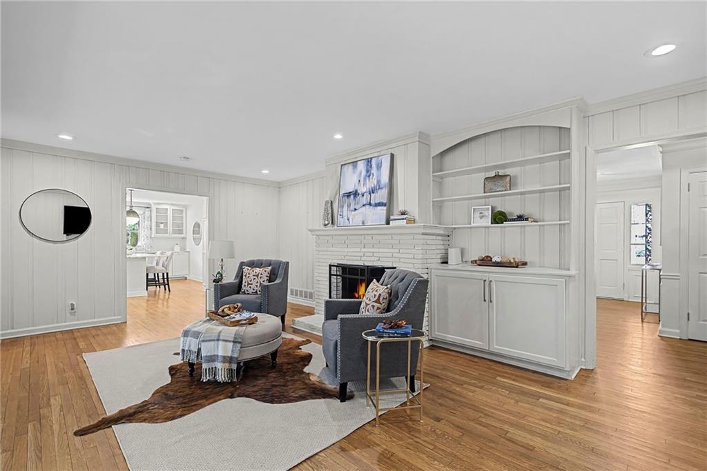 3819 North Stratford Road Northeast Atlanta, GA 30342 - Photo 15 of 48 a living room with furniture and a fireplace