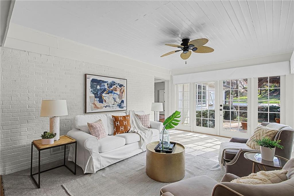 3819 North Stratford Road Northeast Atlanta, GA 30342 - Photo 18 of 48 a living room with furniture potted plant and window